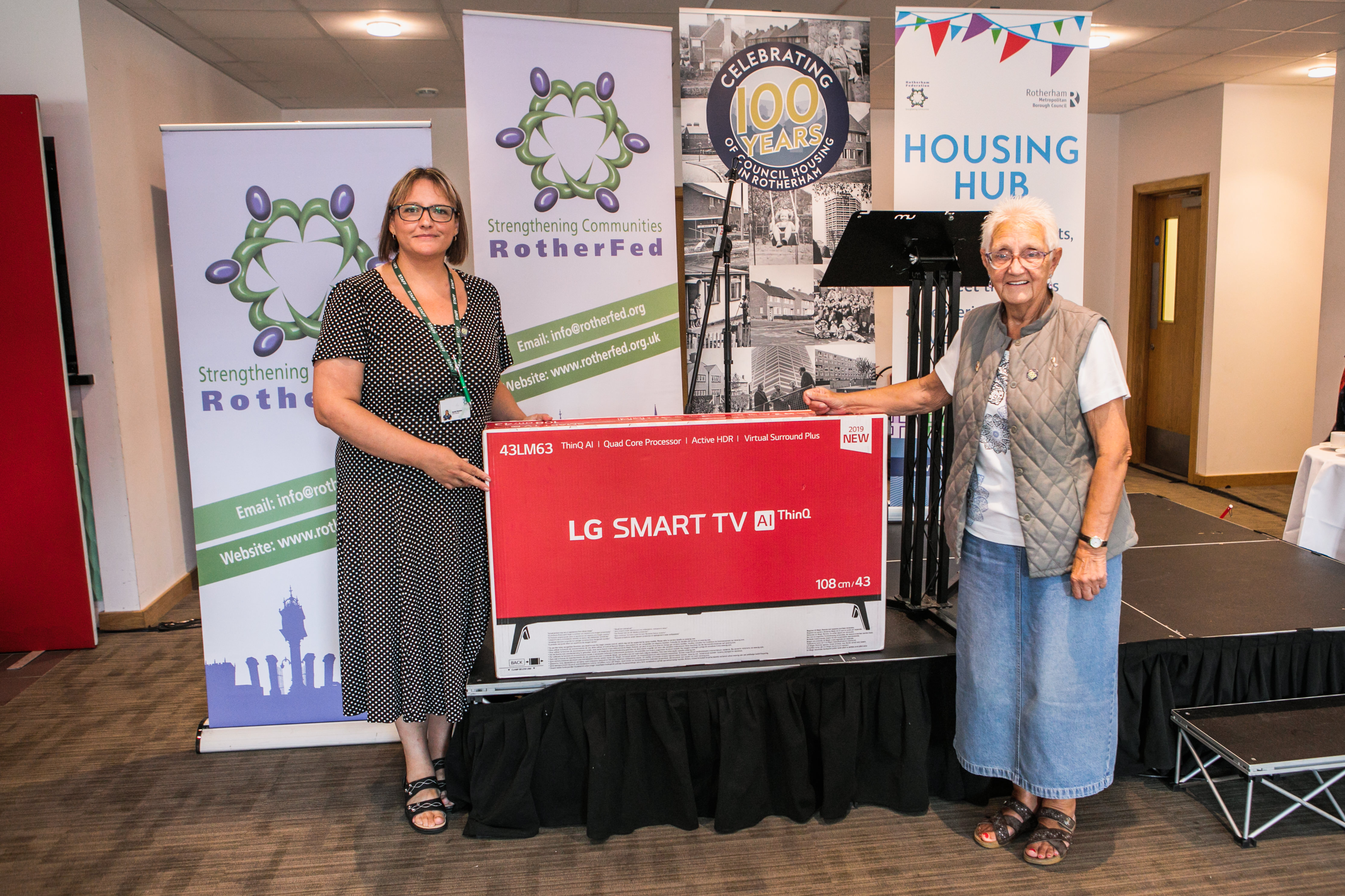 Two women from Rotherfed holding a new TV