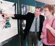 Two people look at a display